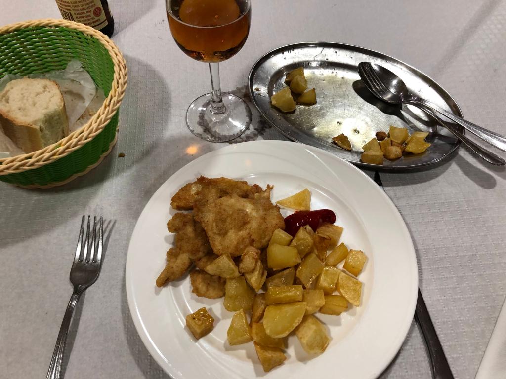 Fried chicken with fried potatoes.